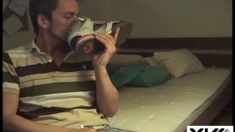 Naughty gay guy baptizing his new shoes with a solo session